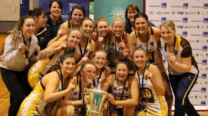 OUR TEAM: Northern Hawks celebrate after winning the 2018 State League grand final.