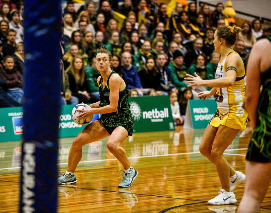 STANDING UP: Cavaliers midcourter Lucy Dennis pauses between passes in a first-ever grand final after two decades of netball. Picture: Scott Gelston