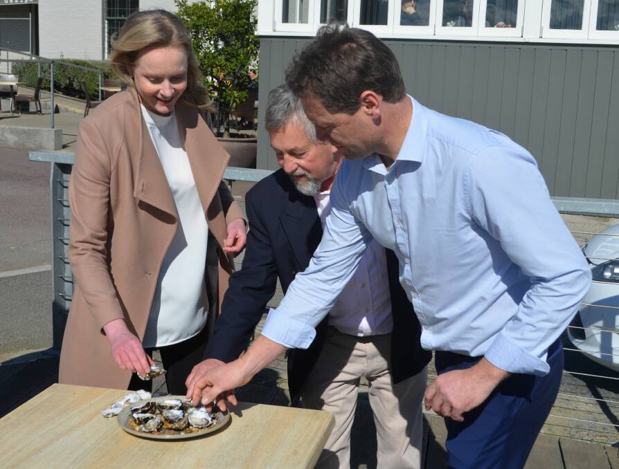 SIDE DISH: Roden has a taste as Oysters Tasmania former chairman with State member for Bass Sarah Courtney and ACA aquaculture managing director Craig Lockwood. 