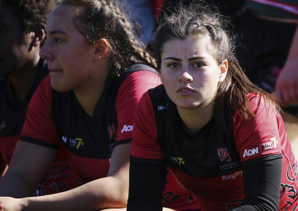 WATCHOUT: Alice Robinson gets a rest on the bench during UTAS Lions clash with University of Adelaide. 