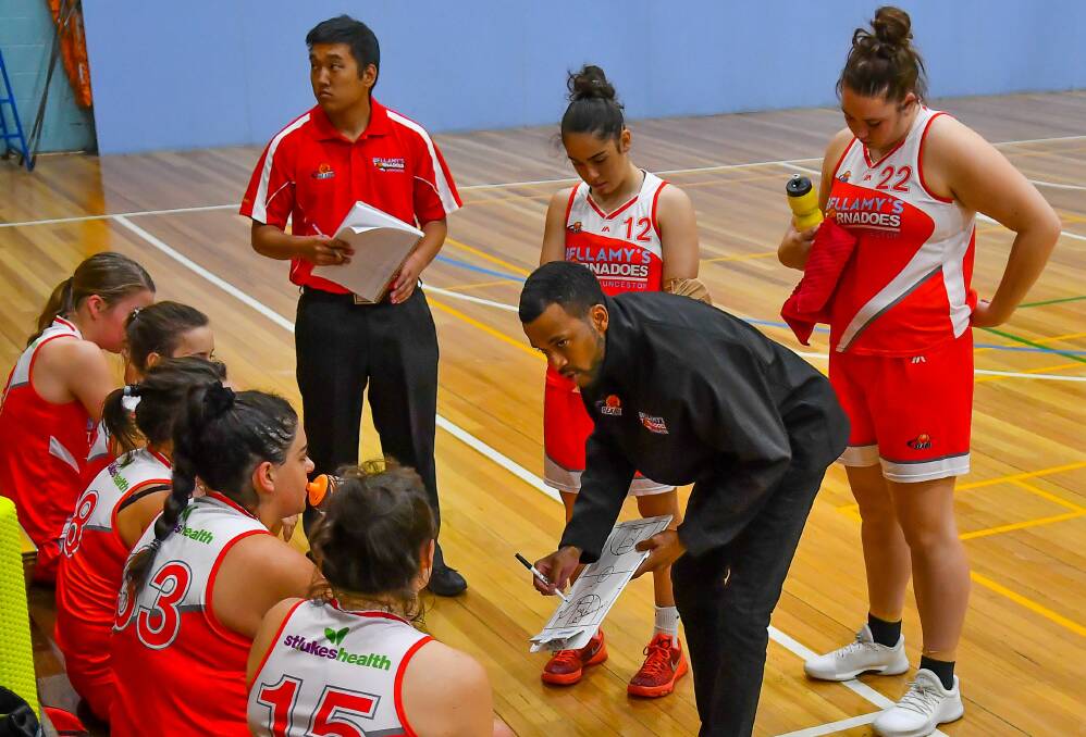 THE GOOD OIL: Launceston coach Derrick Washington delivers fresh advice to his new team during a timeout against Hobart.