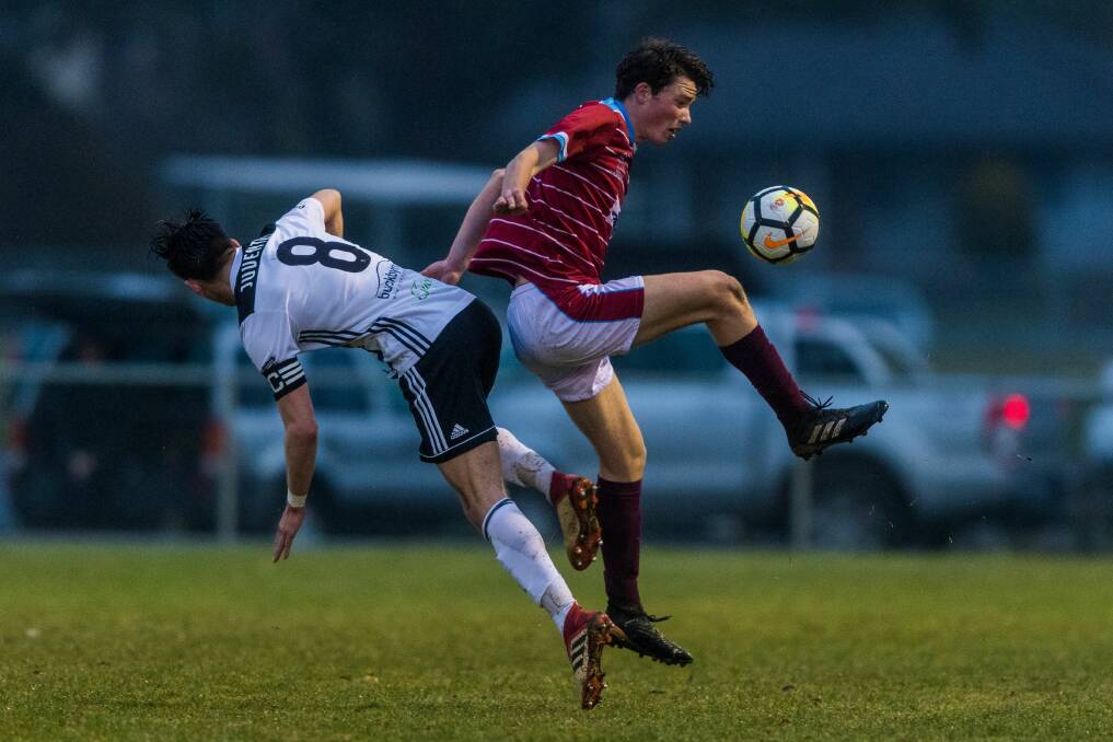 BIG CLASH: Launceston City's Daniel Syson and Northern Rangers' William Humphries collide during last week's final derby of the year. Picture: Phillip Biggs