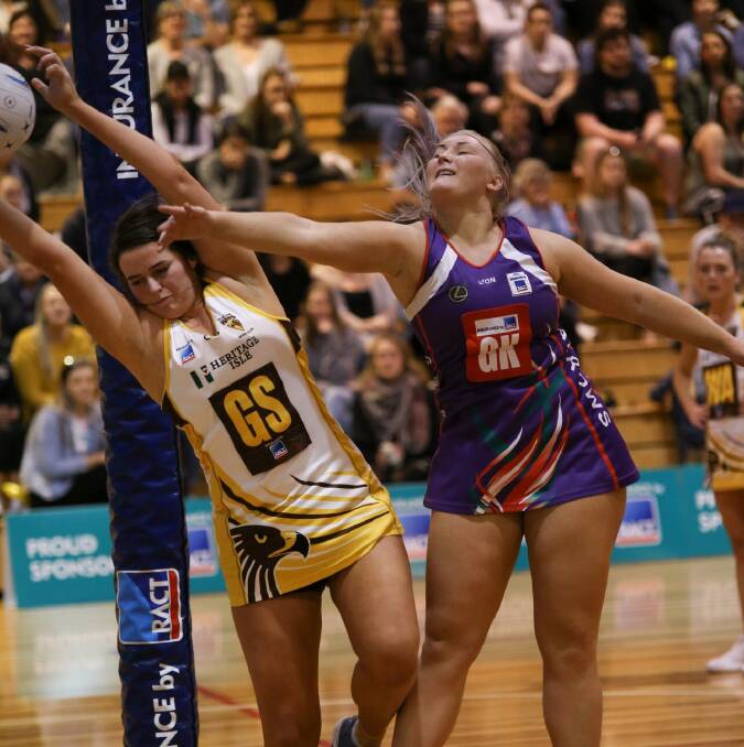 HOLDING ON: Northern Hawks goal ace Ashlea Mawer looks to protect her space from Arrows keeper Zoe Gough in Saturday's State League netball grand final at the Hobart Netball and Sports Centre. Pictures: Andrew Zielinski