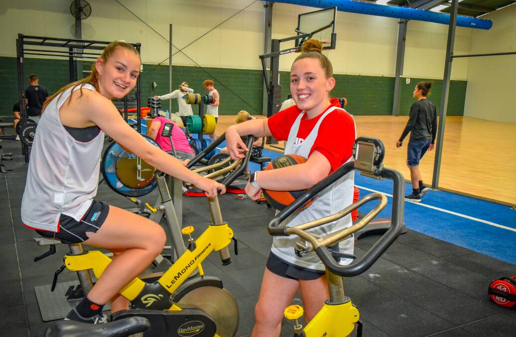 SUMMER SLAM: Launceston hopeful Micah Simpson and Tornadoes teenager Sophie Ackerly get in an extra session at KFM Fitness ahead of the basketball club's first tryouts starting next month. Picture: Paul Scambler
