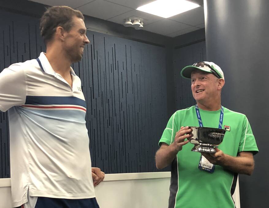 WINNERS: US doubles champion Mike Bryan enjoys the win with coach David Macpherson. Picture: Andrew Eichenholz/ATP World Tour