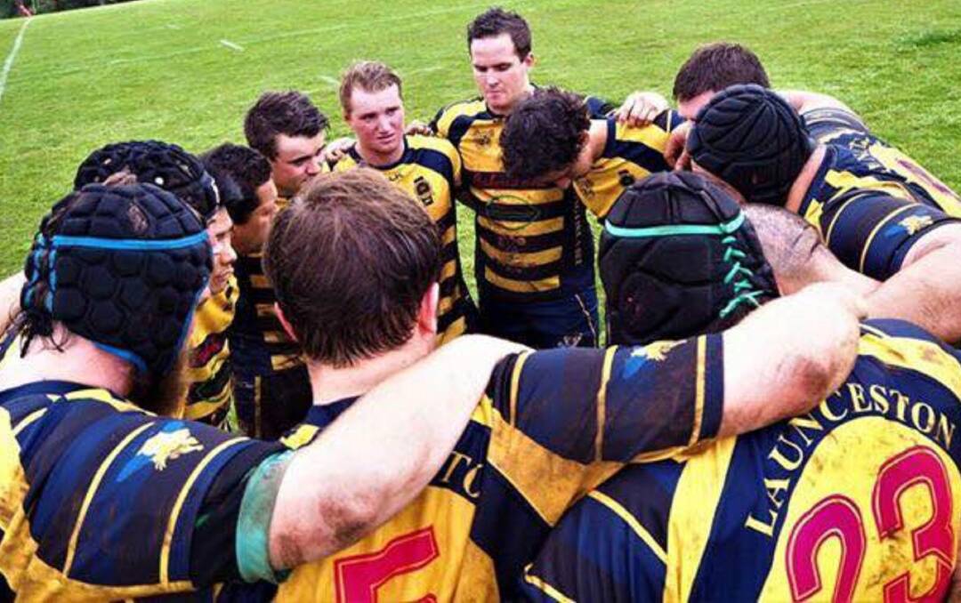 SOLEMN: Launceston Bees huddle after their defeat. Picture: Launceston Rugby.