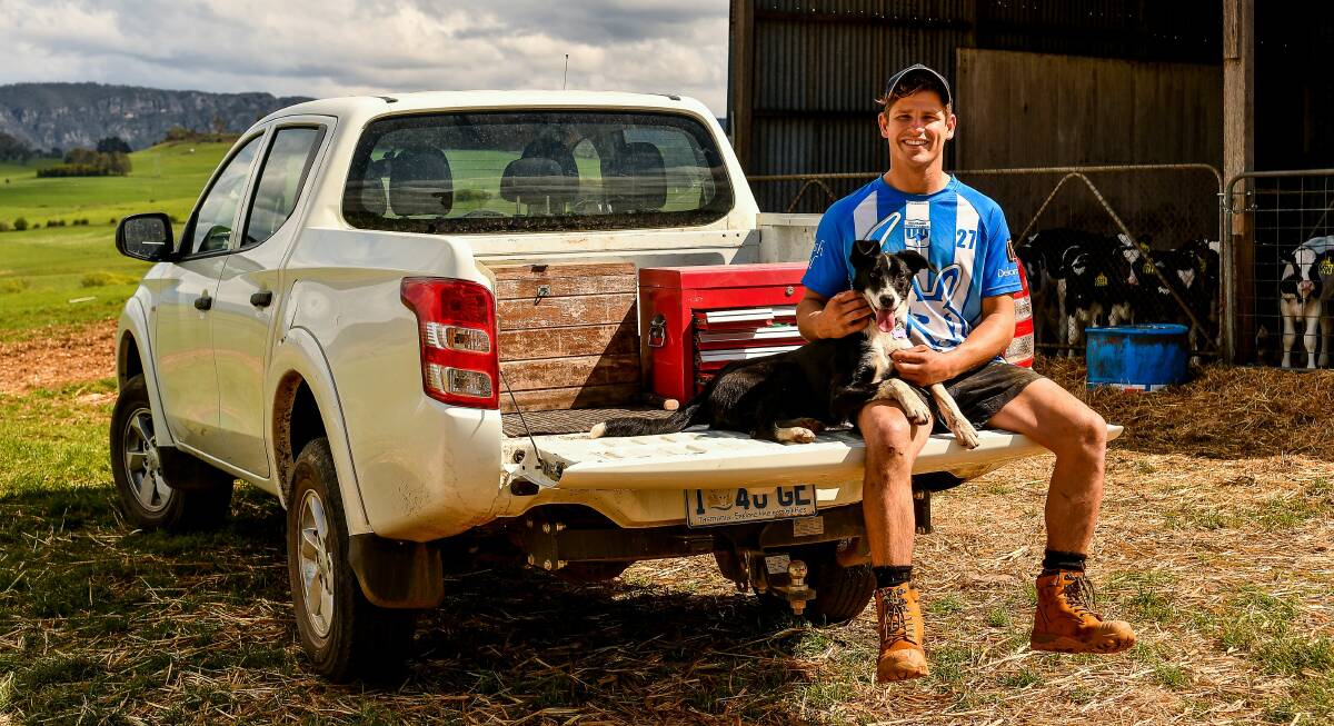 MY PATCH: Lochie Dornauf gets comfortable on the back of his ute with his dog. Pictures: Scott Gelston