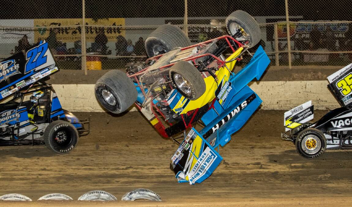 FLYER: An unharmed Curt Smooth spectacularly crashes his sprintcar Saturday night. Picture: Angryman Photography