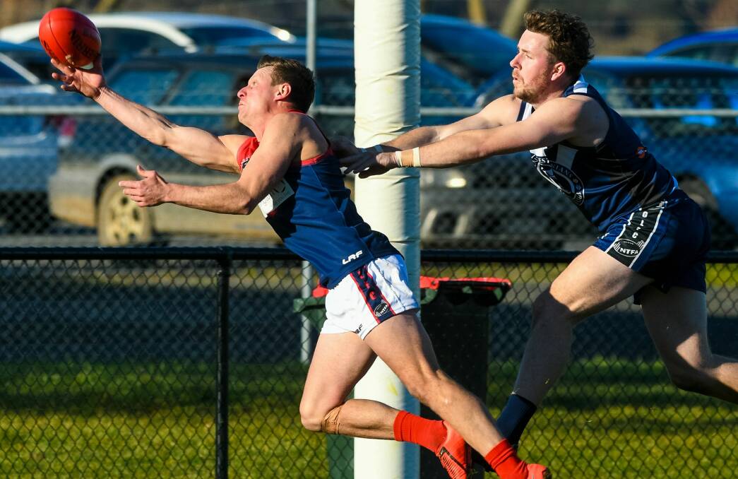 GET A GRIP: An outstretched Sonny Whiting reaches for the mark in Lilydale's away clash to Old Launcestonians at Invermay Park on Saturday. Picture: Phillip Biggs. 