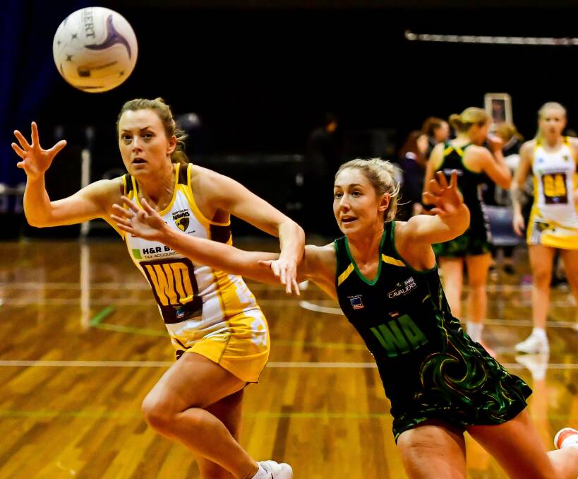 LAST EFFORT: Northern Hawks hero Ashton Whiley keeps her rival Shelby Miller at bay in one of the final contests between the pair. Picture: Scott Gelston