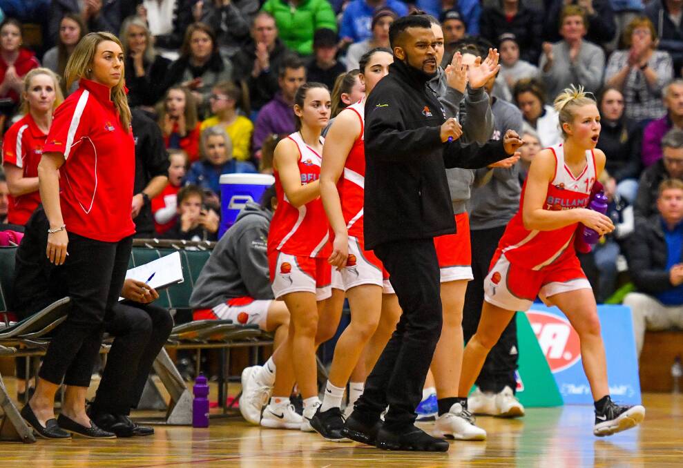 PUMPED UP: Coach Derrick Washington shows his emotions from the bench during the closing stages of the side's win to qualify for the SEABL grand final. Picture: Scott Gelston