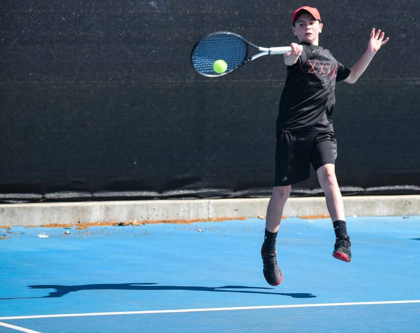SMASHING SHOT: Launceston's Jack Elmer times a sweet forehand volley at the state's junior championships during the week at the Launcestion Regional Tennis Centre. Picture: Paul Scambler