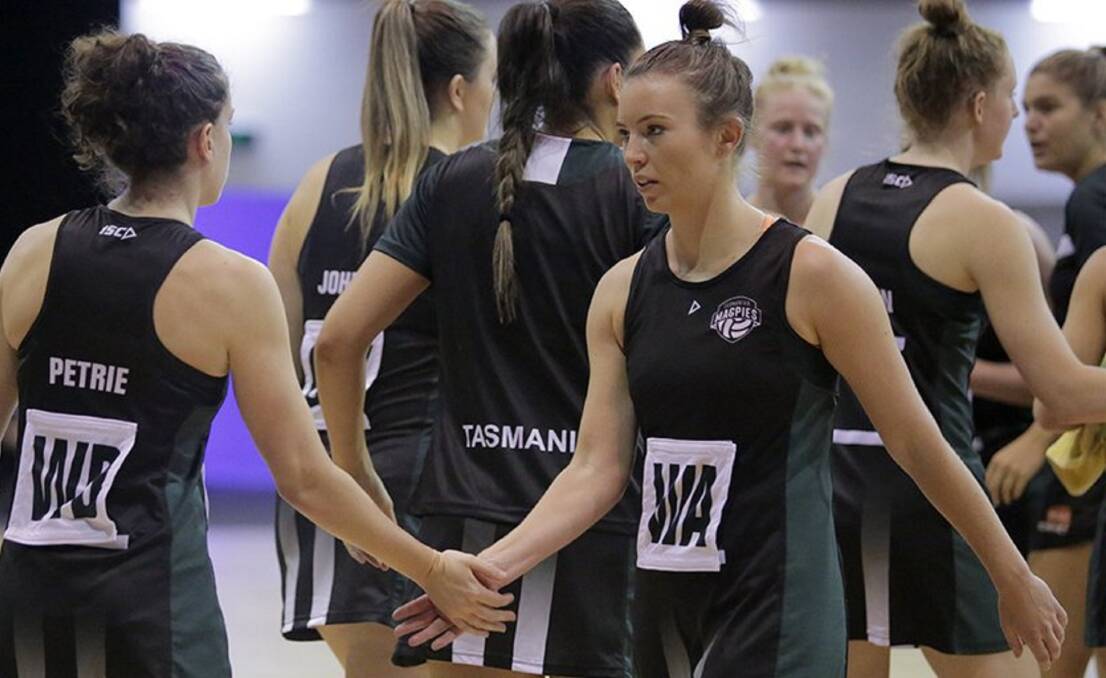 UNITE: Homegrown Tasmanians Caitlin Petrie and Kelsie Rainbow share in the Magpies win over Southern Force.