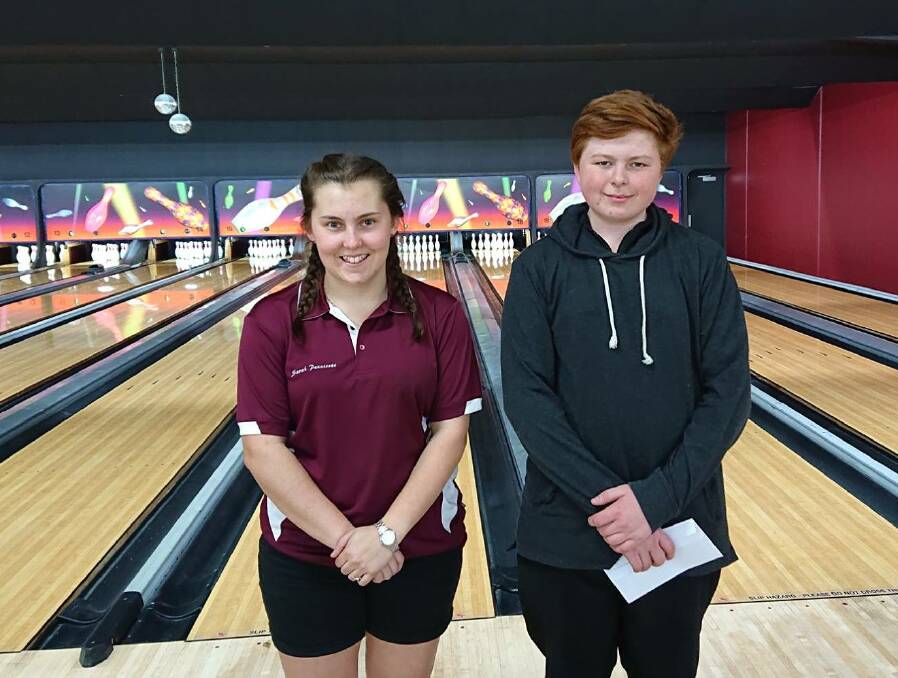 INSIDE THE LANES: Sarah Pennicott and Liam George after their junior title wins.