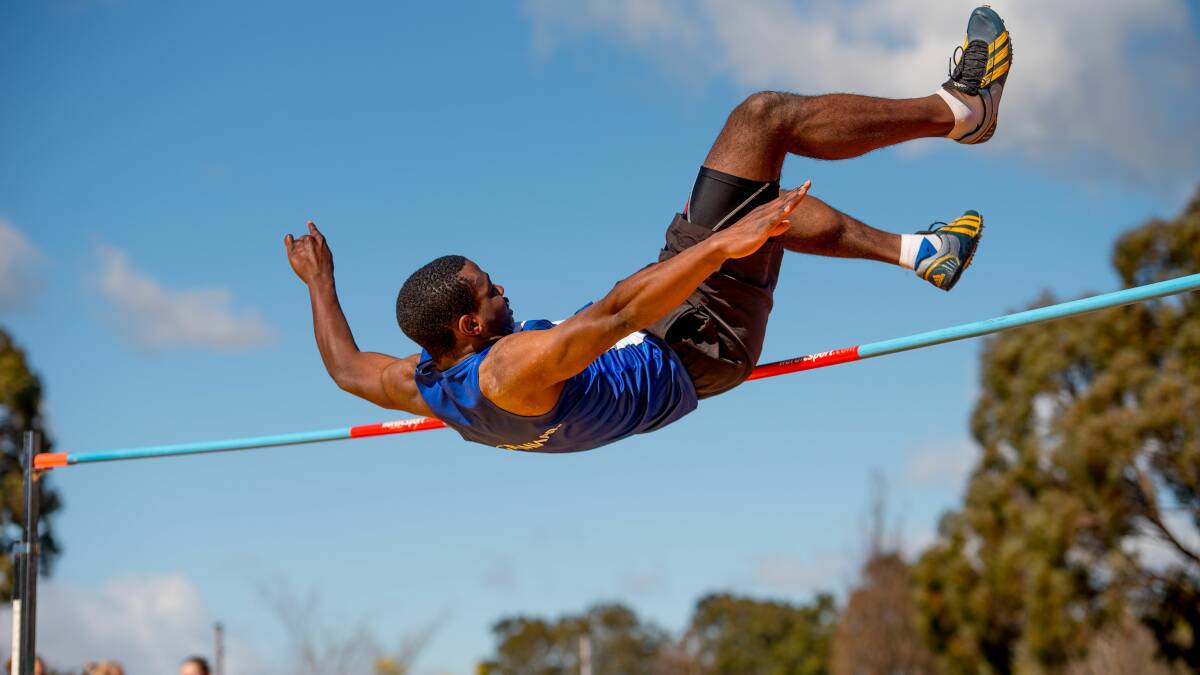 LEAPER: Launceston Church Grammar's Chack Kadima bends his way and clears the bar in the boys under-16 high jump. 