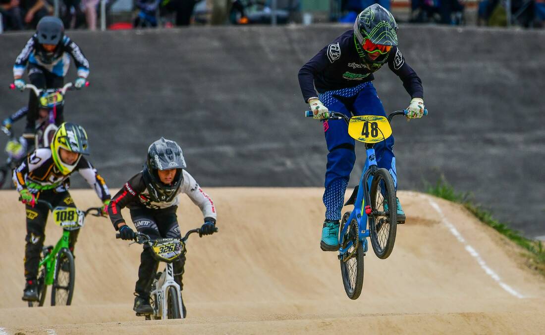 FLYING: Launceston rider Campbell Whitney takes the early lead on his home track at the state BMX titles on Sunday. Picture: Scott Gelston 