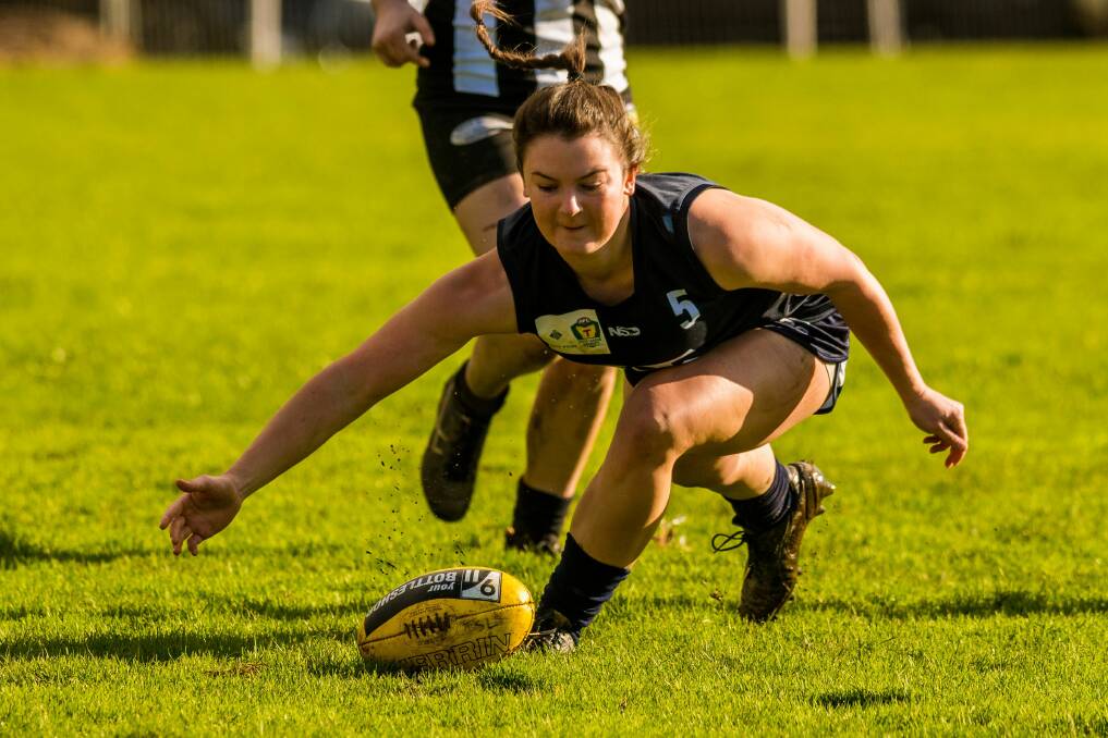 COP THAT: Launceston superstar Courtney Webb looks to thump the ball on towards a teammate in the Blues' clash last week against Glenorchy. Picture: Phillip Biggs