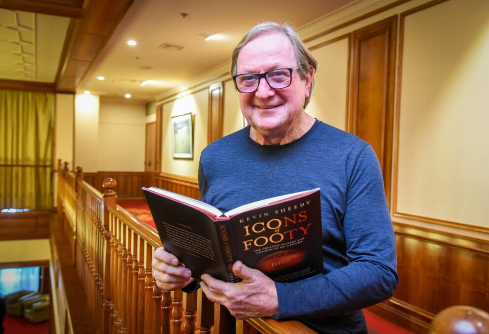 WISE HEAD: Master coach Kevin Sheedy takes a glance at his latest book in Launceston. Picture: Paul Scambler