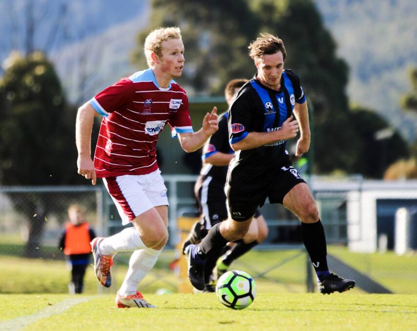 ON THE MARCH: Ranger on the rise, Harry Thannhauser, looks to pass the Kingborough Lions defence on his way towards goal in the NPL clash. Picture: Solstice Digital