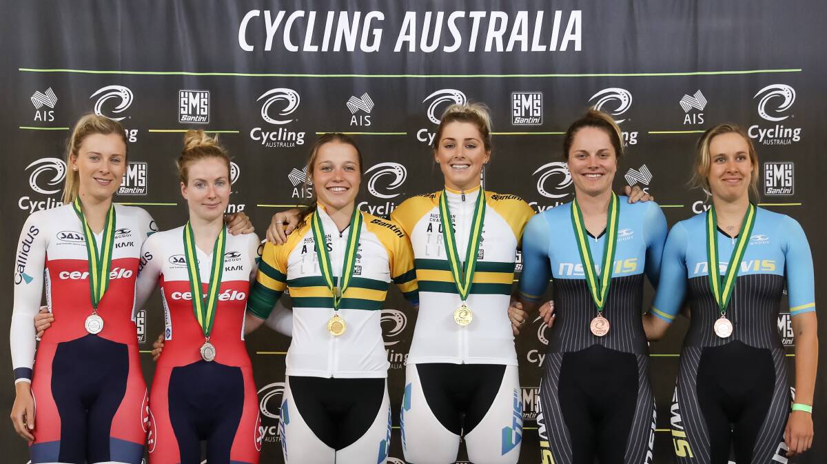 ON THE DAIS: Kristina Clonan and Macey Stewart take centre stage in Melbourne to claim the gold medal in the women's national madison titles. 