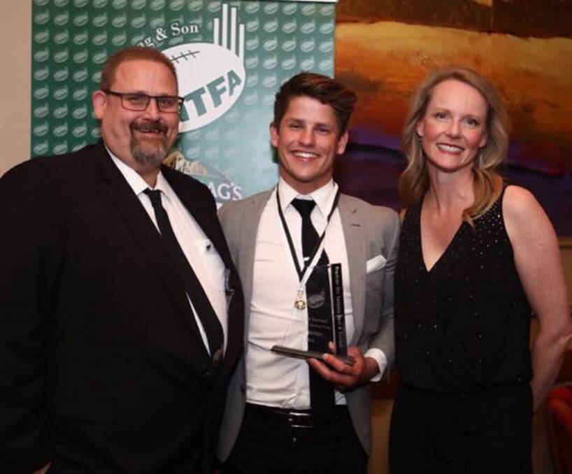 GRIN: Deloraine star Lochie Dornauf enjoys his medal win with NTFA president Scott Rigby and MP Sarah Courtney. Picture: Supplied