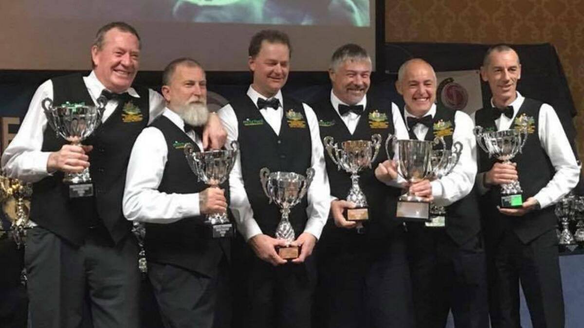TEAM AUSTRALIA: Stubbs, far right, joins in the celebration of the world masters win. Picture: Supplied.