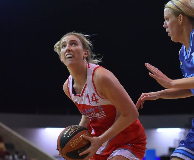 ONLY WAY IS UP: Lauren Nicholson shapes to the basket amid a dominant game that help guide Launceston to a four-point thrilling victory over Hobart. Pictures: Scott Gelston