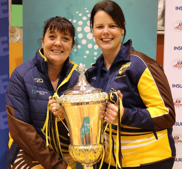 FULL STRENGTH: Kellie Woolnough and Ruth Tuohy hold up netball's State League premiership trophy after Northern Hawks took out the 2018 grand final. Picture: Jess Stevenson