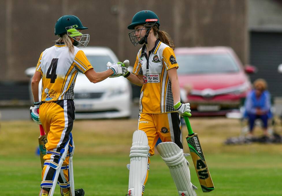 TEAMWORK: Longford pair Kristy Clayton and Emma Humphries fist bump in between balls at the TCL women's grand final clash with Bracknell on Sunday. Picture: Scott Gelston