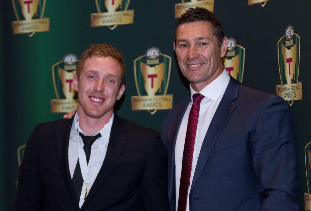 CONGRATULATIONS: Three-time AFL premiership hero Alastair Lynch on hand to present the medal named in the Lion's honour to Brad Cox-Goodyer. Picture: Solstice Digital