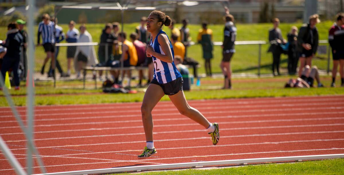 IN STEP: Launceston Church Grammar's Mia Findlay strides her way to victory in the under-14 girls 800 metres.