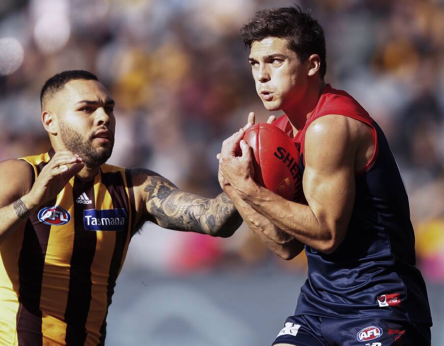 MY BALL: New Demon Jay Lockhart takes it on the chest in front of Hawthorn rival Jarman Impey. Picture: AAP