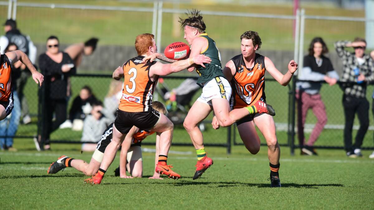 GOTCHA: East Coast teammate Lewis Ritchie joins tackler Jack Rushton in trapping St Pats rival Jacob Murphy on Sunday. Picture: Paul Scambler