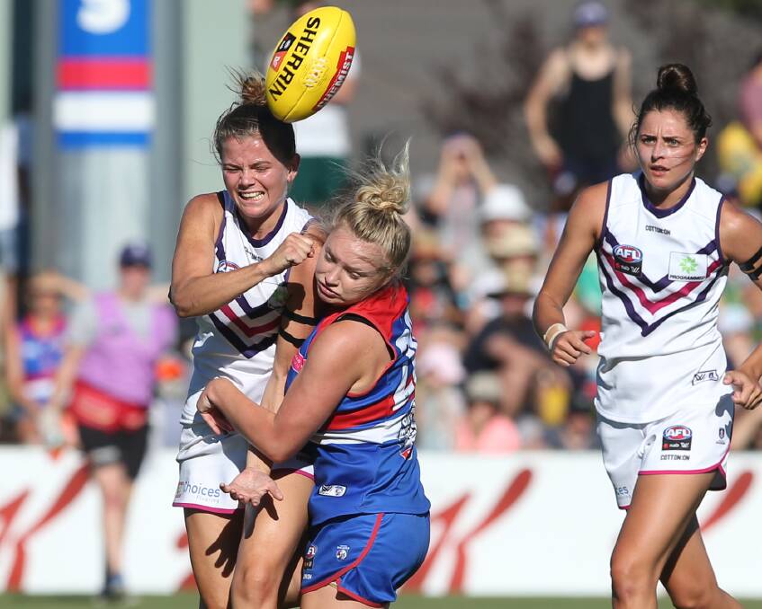 BRUTAL: Injured former Western Bulldogs rookie Daria Bannister will watch the current AFLW premiers from the North Melbourne-Tasmanian side of the fence. Picture: AAP