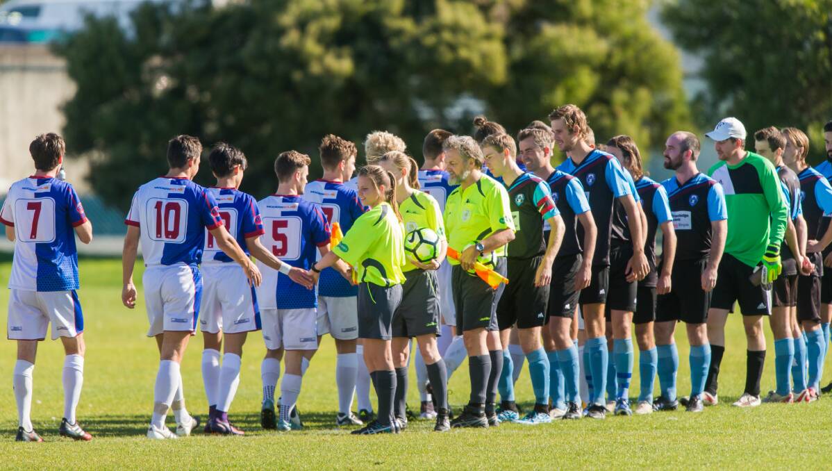 ALL THE BEST: Northern Rangers and Hobart club Nelson go through the before-match formalities of their Lakoseljac Cup encounter at the NTCA No.2 ground. Picture: Phillip Biggs.
