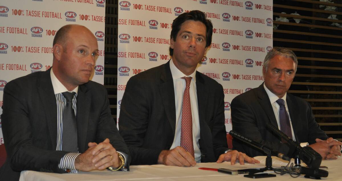 SPOTLIGHT: Outgoing AFL Tasmania chairman Dominic Baker sits with AFL supremo Gillon McLachlan and former AFL Tasmania chief executive Scott Wade back in 2014.