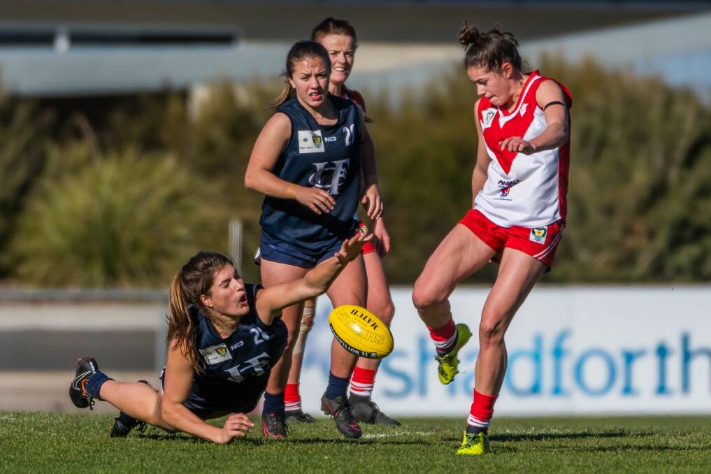 DESPERATION: Launceston talent Kate Mclaughlin shows her readiness to get in and under to stop another Clarence attacking raid during Sunday's TSLW encounter at Windsor Park. Pictures: Phillip Biggs