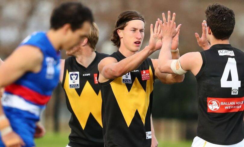 EASY WORK: Matt Hanson joins in the celebration after a Werribee goal. Picture: Supplied.