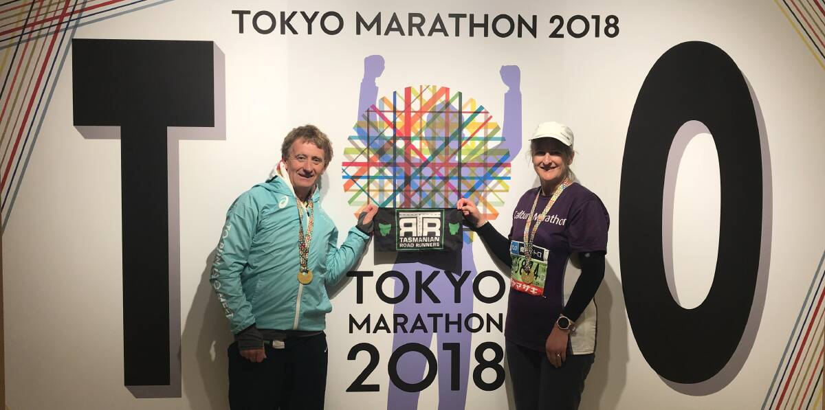 WE'RE HERE: Andrew and Patsy Law sharing their love of marathons at Tokyo. 