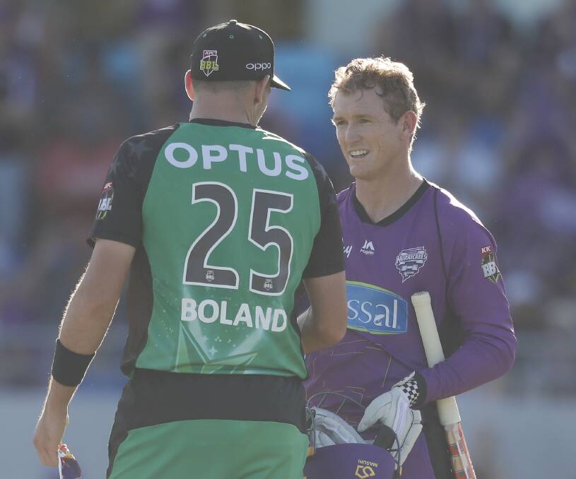 KUDOS: Melbourne Stars paceman Scott Boland congratulates Hobart Hurricanes veteran George Bailey last time they meet on Christmas Eve. Picture: AAP