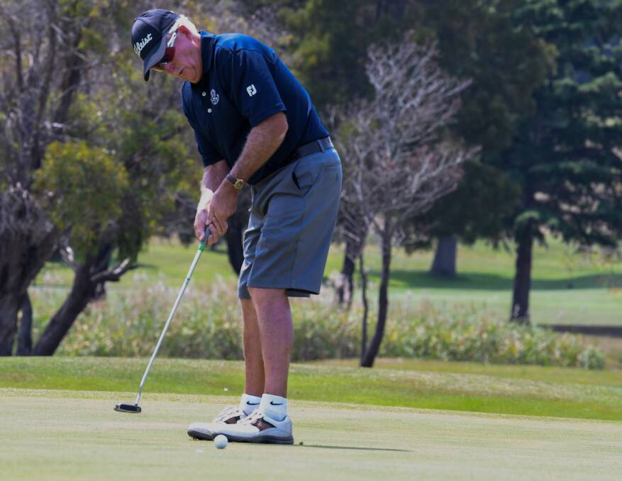 LEFT: Leedham is a picture of concentration as he lines up a putt amid the state senior championship at Mowbray this year.