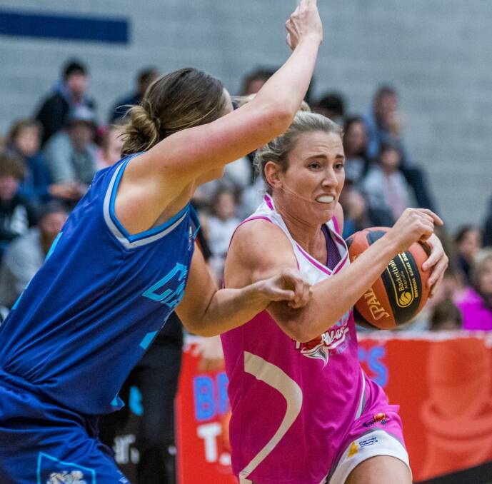 THE STRUGGLE IS REAL: Lauren Nicholson attempts to pass through the Hobart Chargers' defence in the tight tussle at Elphin Sports Centre on Saturday night. Picture: Phillip Biggs