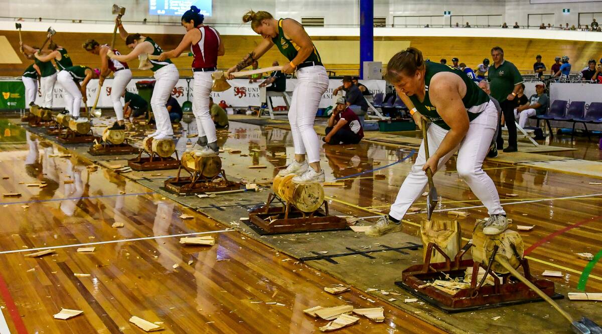 THE MOMENT: Amanda Beams (right) gets through the final chop that ensured her first individual woodchopping world title in front of the home crowd. Picture: Scott Gelston