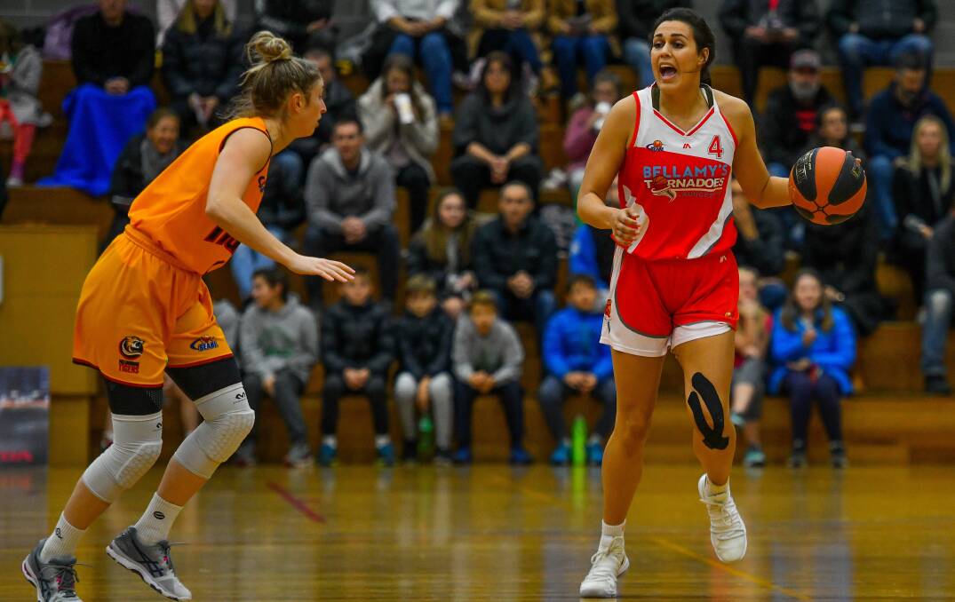 HEAR ME: Tornadoes top-scorer Ally Wilson calls out a play amid a tight tussle against Melbourne Tigers on Saturday night at Elphin Sports Centre. Pictures: Scott Gelston
