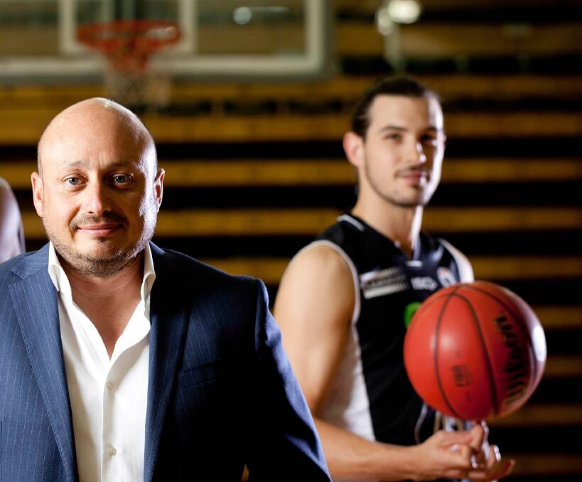 TASSIE TRIAL: NBL owner Larry Kestelman with Launceston-born Chris Goulding before the announcement of the NBL blitz coming to Tasmania. Picture: AAP