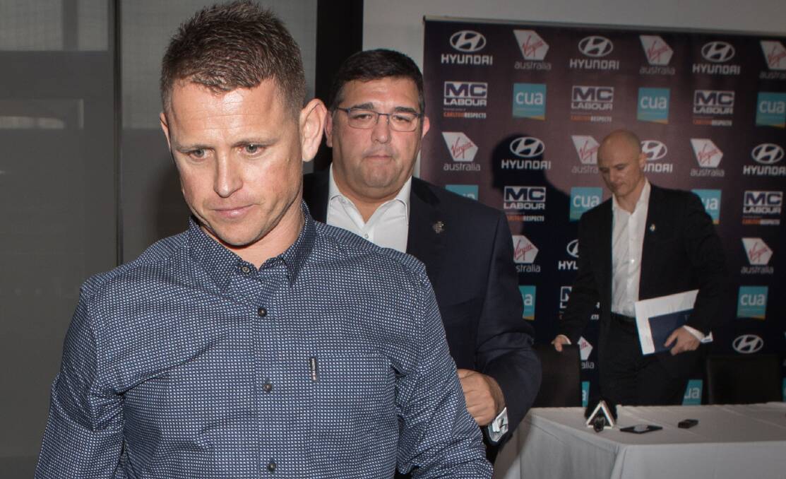 THAT'S IT: Brendon Bolton leaves a press conference back in June after Carlton had ended his three-and-a-year coaching tenure. Picture: Jason South
