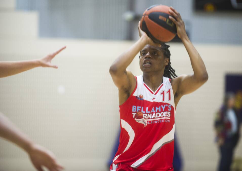 FINISHER: Launceston import Courtney Williams shoots for a three-pointer in a breakthrough weekend for the American.