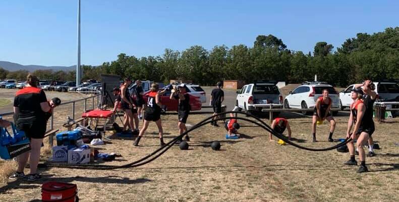 PULLING TOGETHER: Tasmania Devils go through the preseason motions to test their strength and endurance.