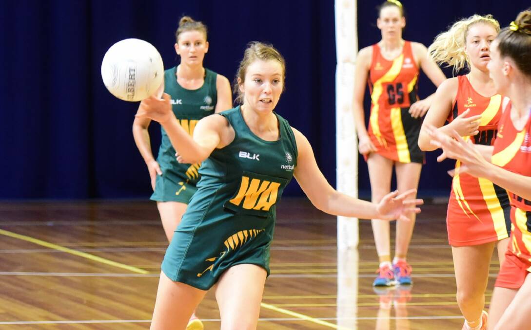 PASSING INTEREST: Kelsie Rainbow gets in practice for Tasmania ahead of a request to join the Australian Diamonds shadow squad for training. 