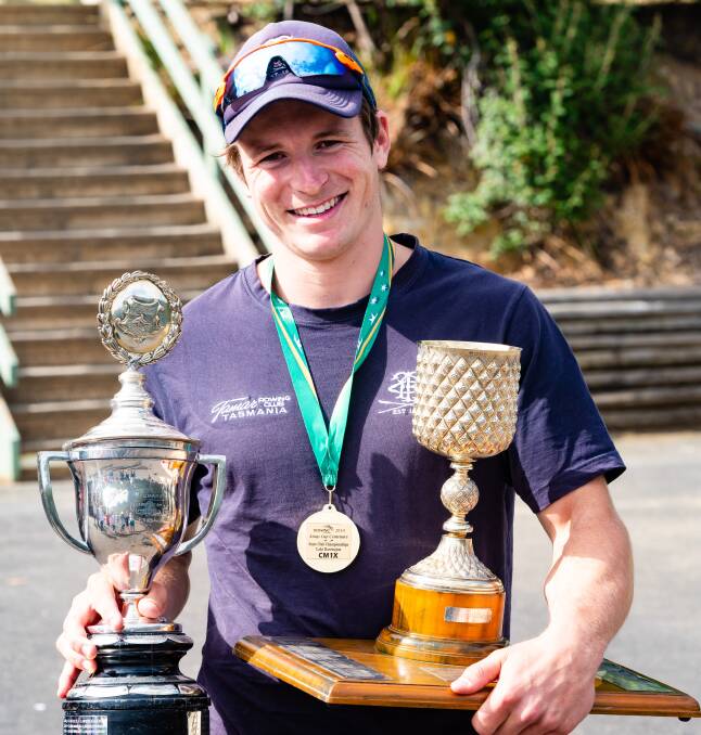 HANDFUL: Youl holds up the rewards from the record-breaking rowing day.